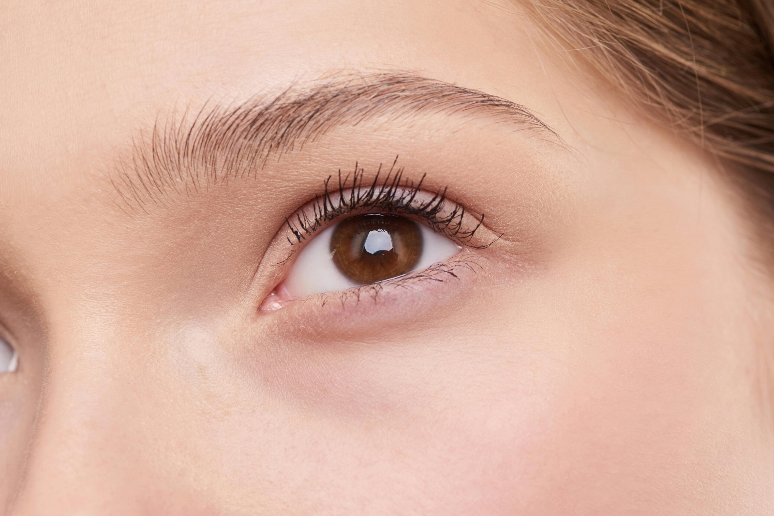 Close up of a woman's face with no wrinkles